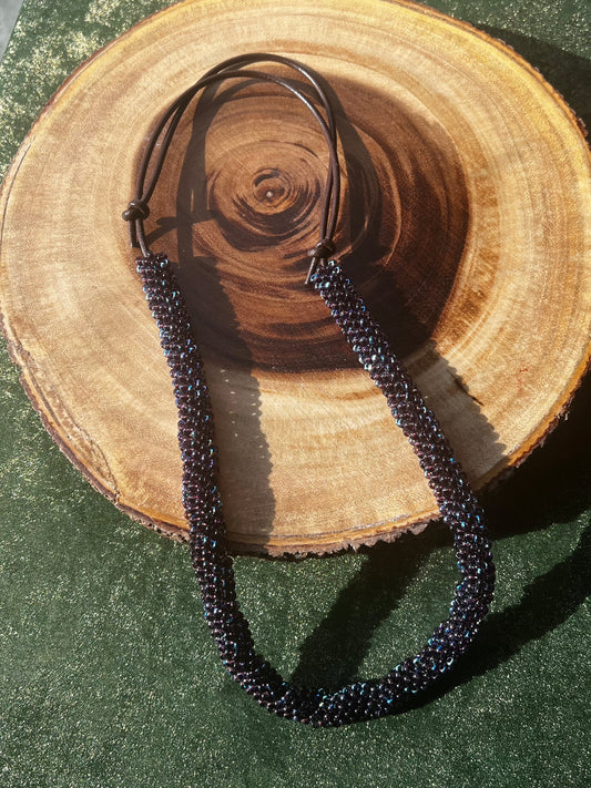 Hand beaded, minimalist, adventure ready necklace.